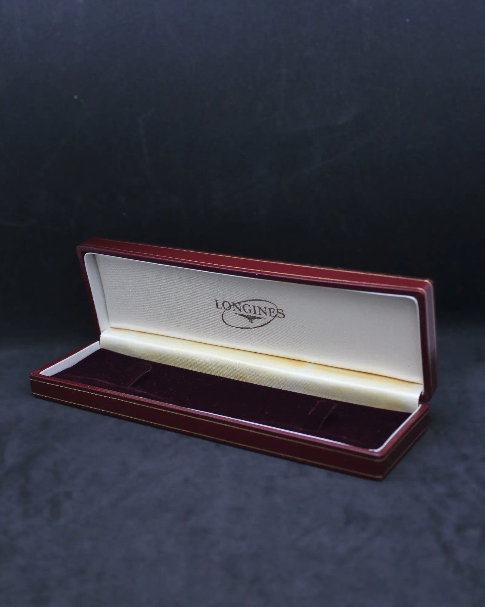 Vintage Longines Red Slender Clamshell Watch Box with Iconic Oval Logo – (ca. 1957-1965)
