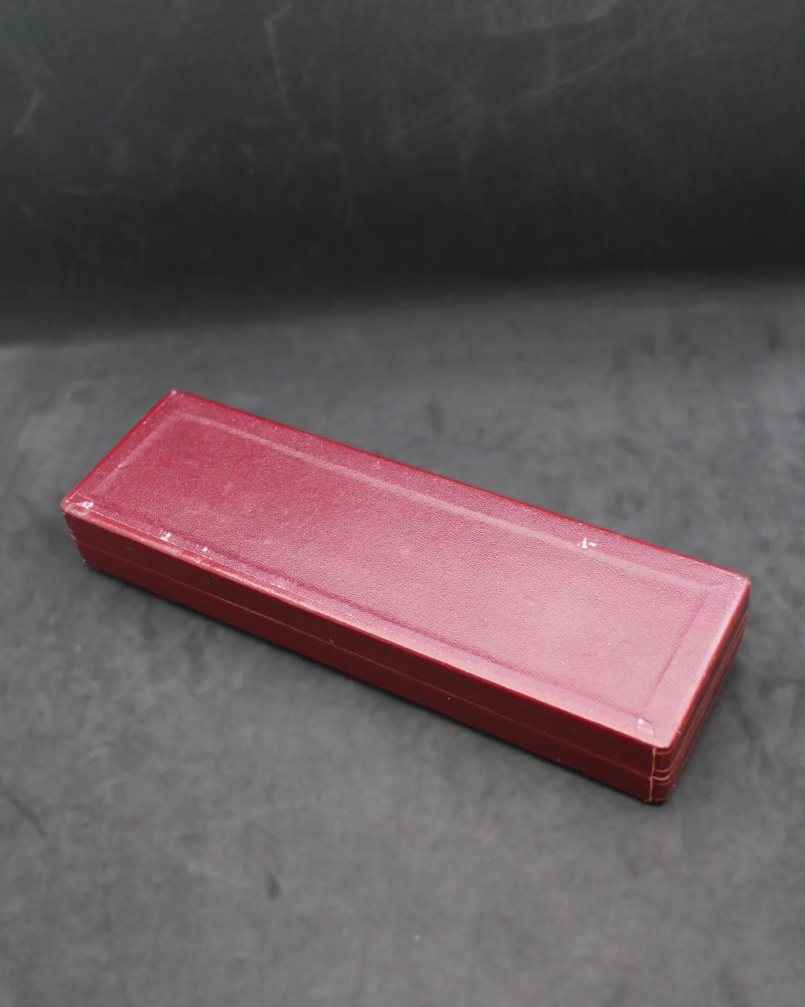 Vintage Longines Red Slender Clamshell Watch Box with Iconic Oval Logo – (ca. 1957-1965)