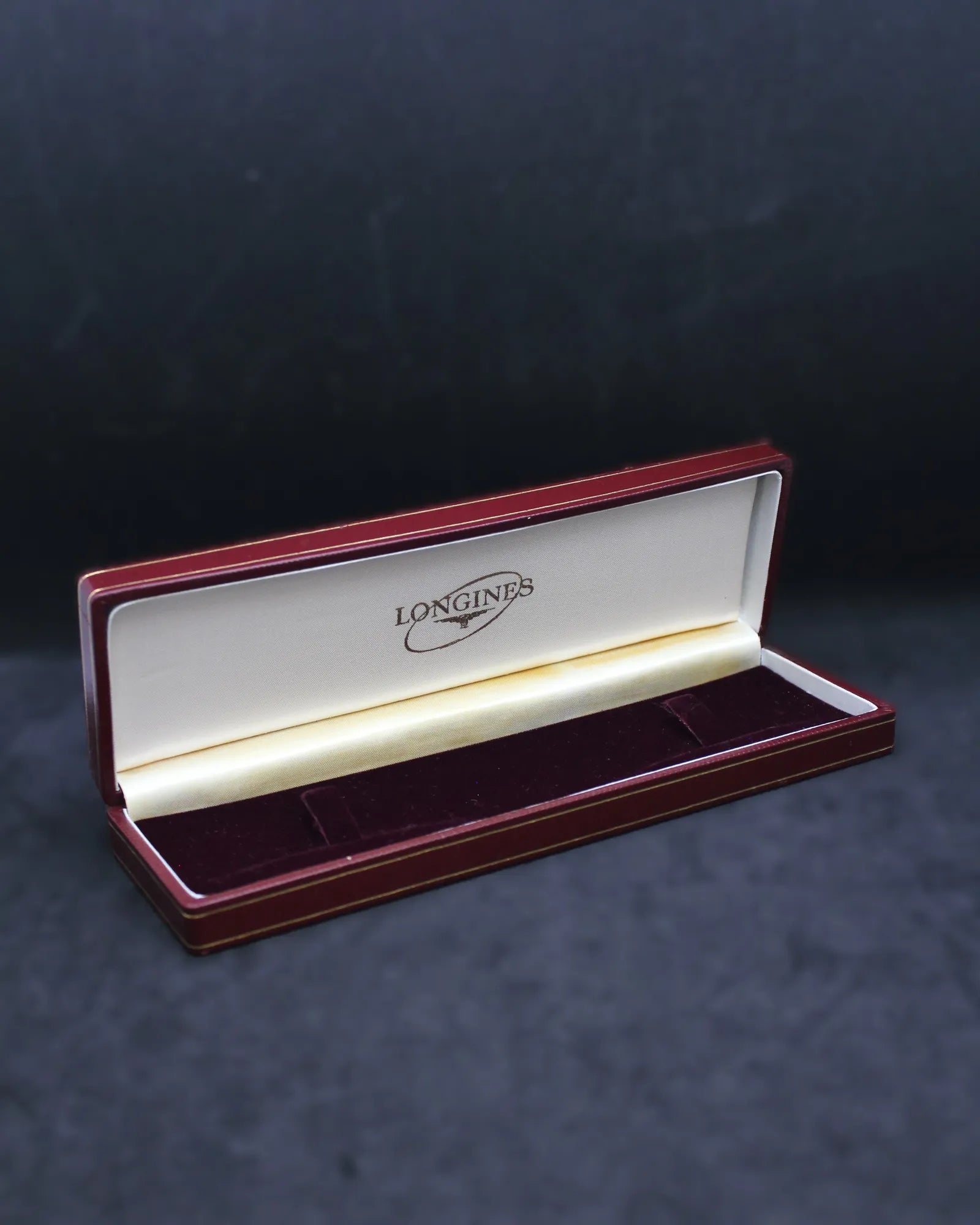 Vintage Longines Red Slender Clamshell Watch Box with Iconic Oval Logo – (ca. 1957-1965)