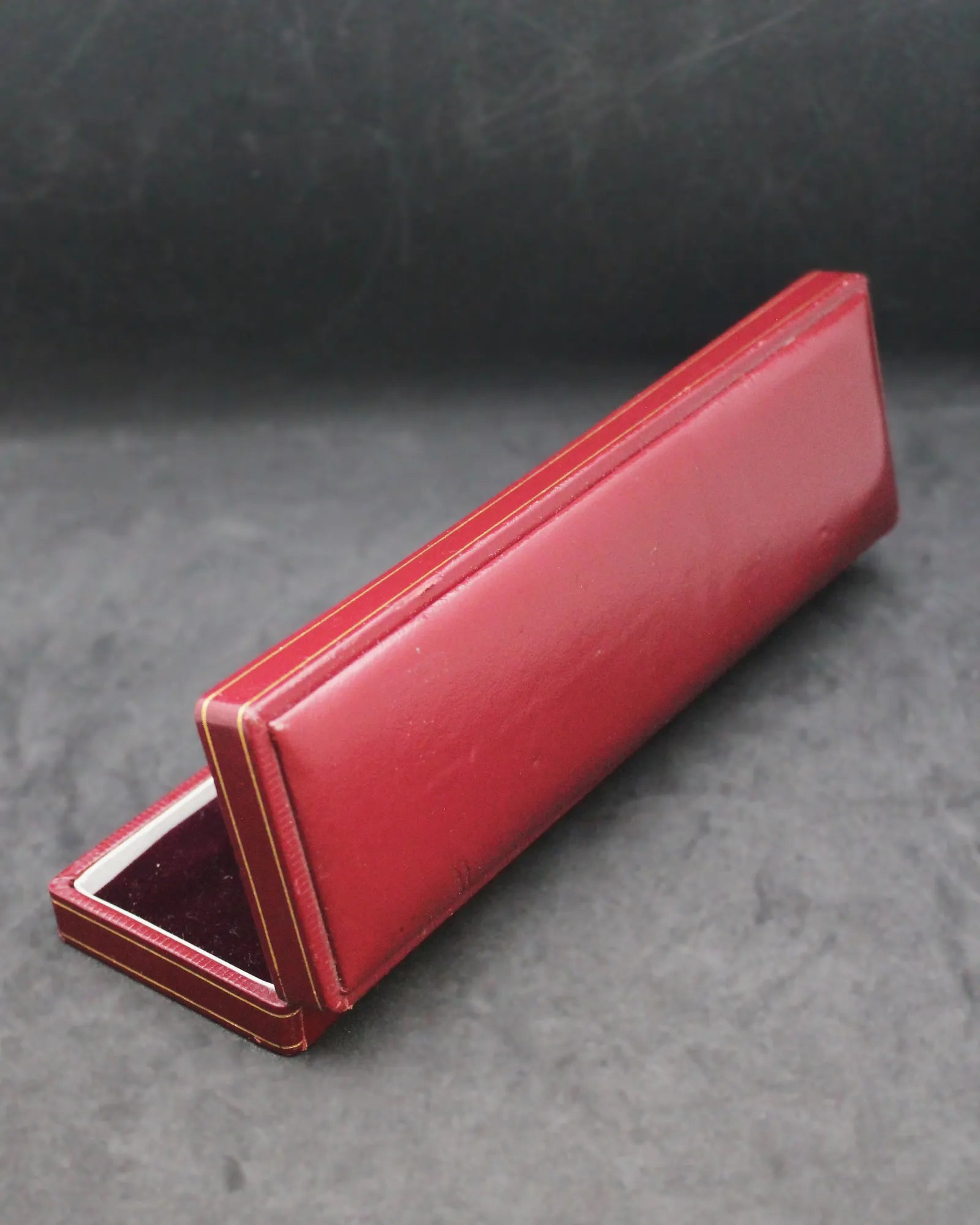 Vintage Longines Red Slender Clamshell Watch Box with Iconic Oval Logo – (ca. 1957-1965)